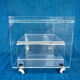 Translucent plexiglass storage drawer/cabinet on wheels.