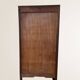 Low curtain cabinet in dark wood