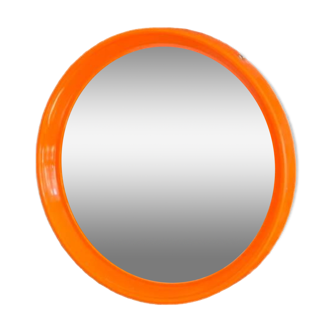 Orange round mirror