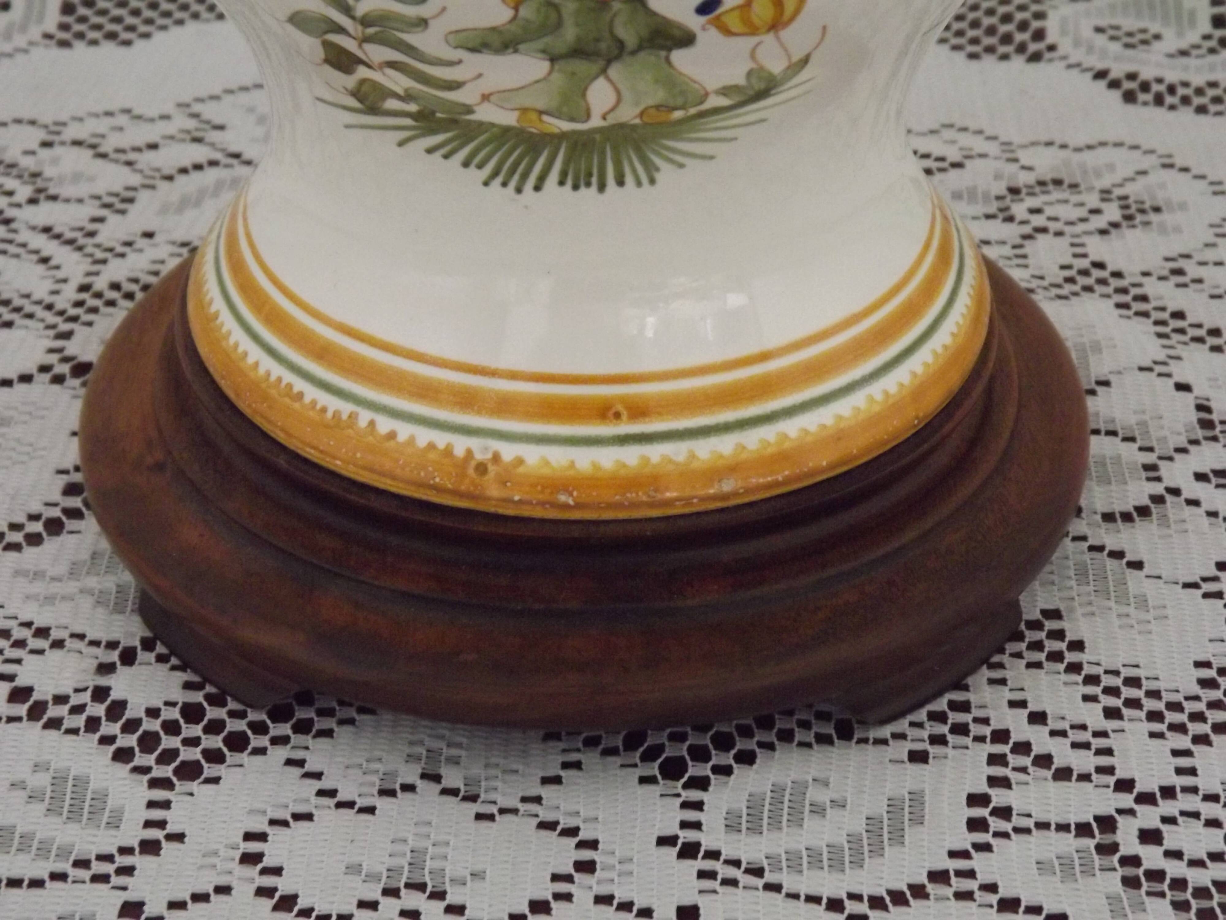 Table lamp with wooden base and fringed shade