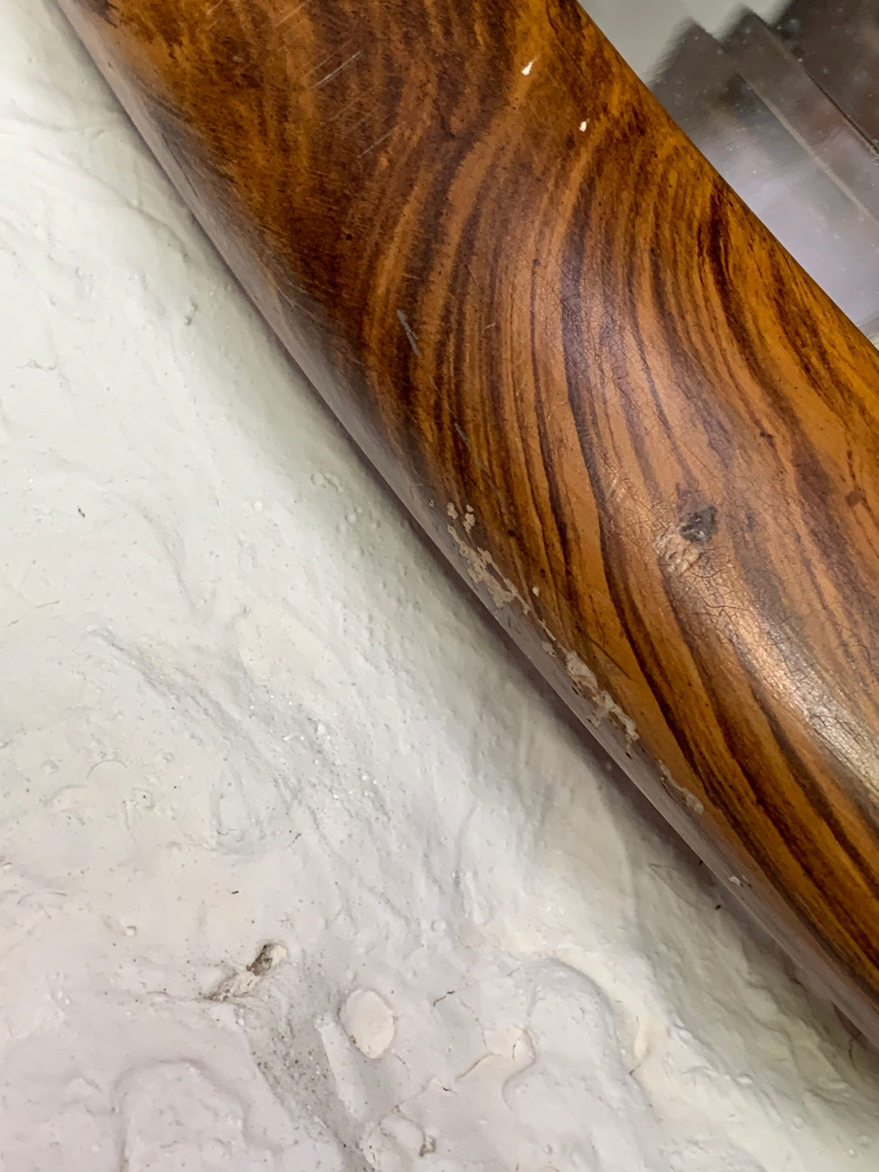 Oval wooden and stucco wall mirror