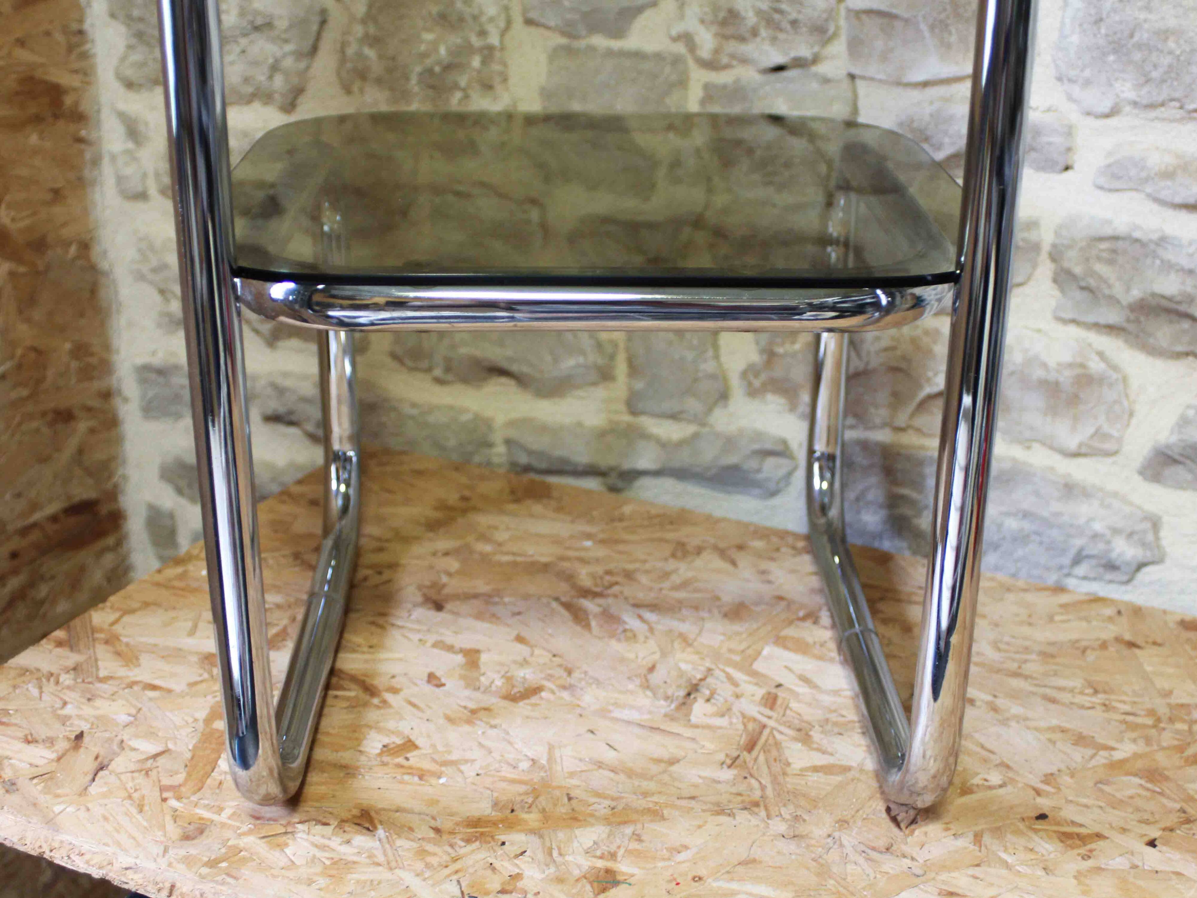 Chrome metal and smoked glass side table.
