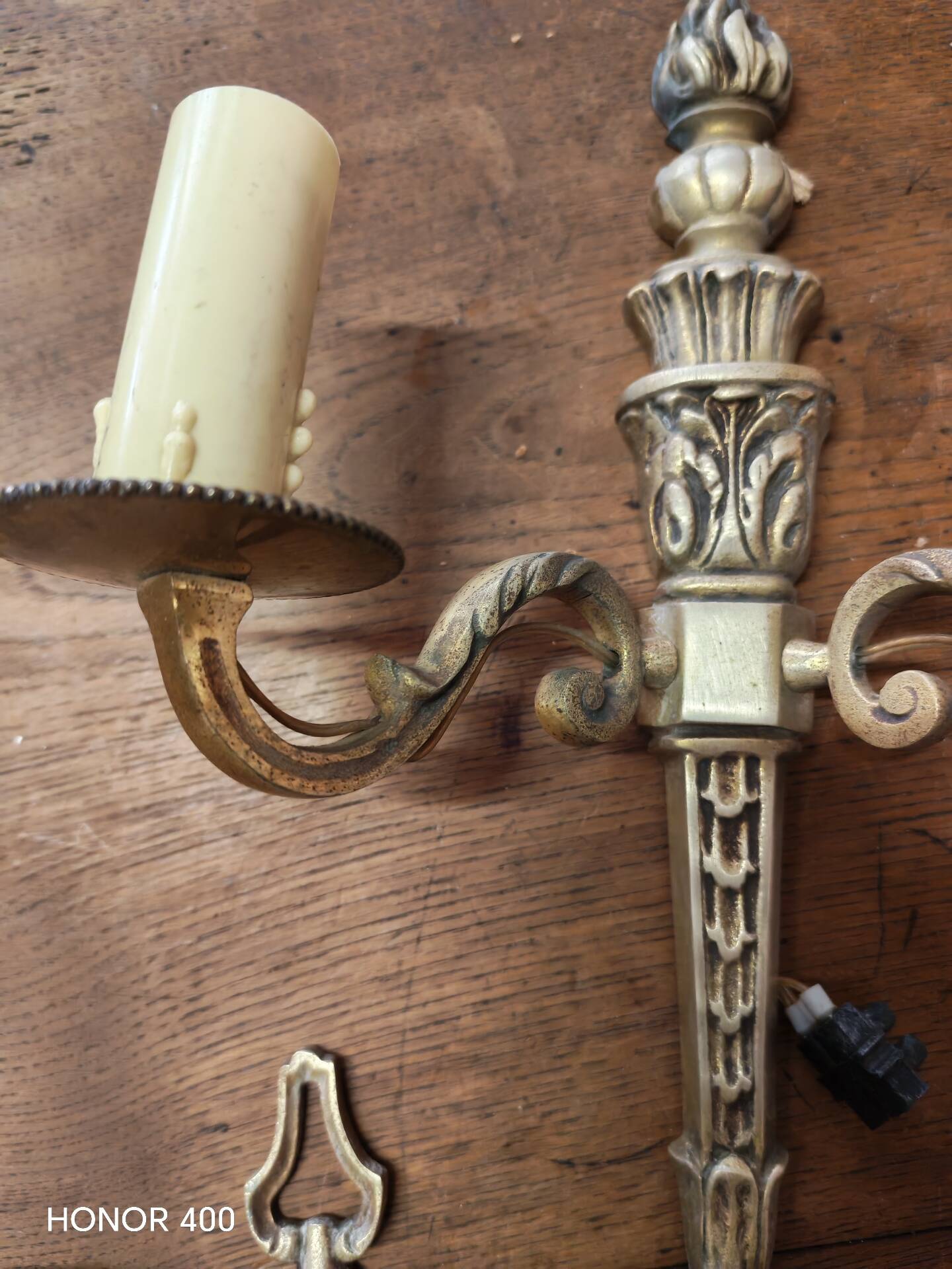 Two antique wall sconces in gilded bronze in the Louis XVI style.