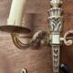 Two antique wall sconces in gilded bronze in the Louis XVI style.