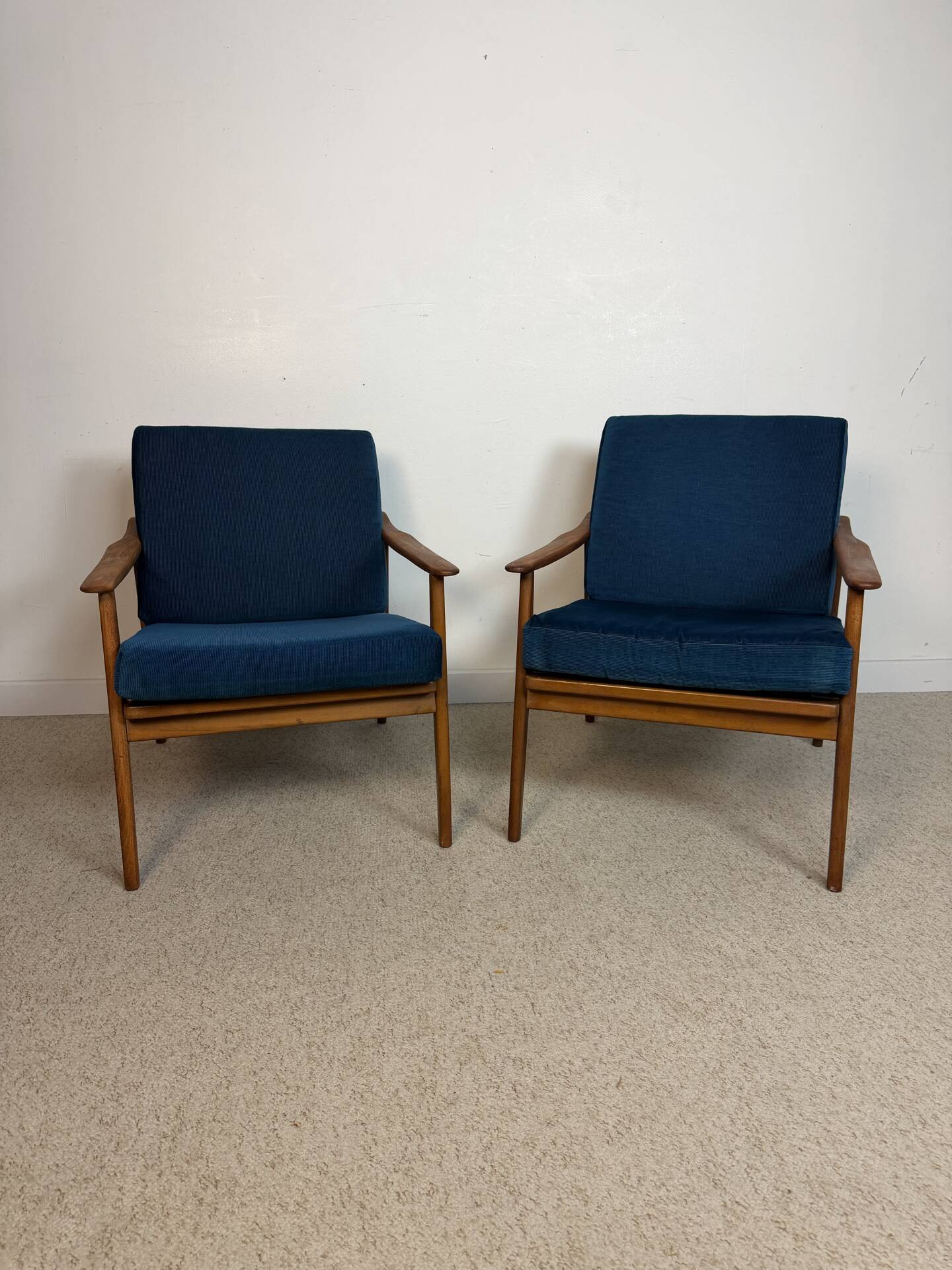 a pair of Scandinavian armchairs in teak from the 1960s