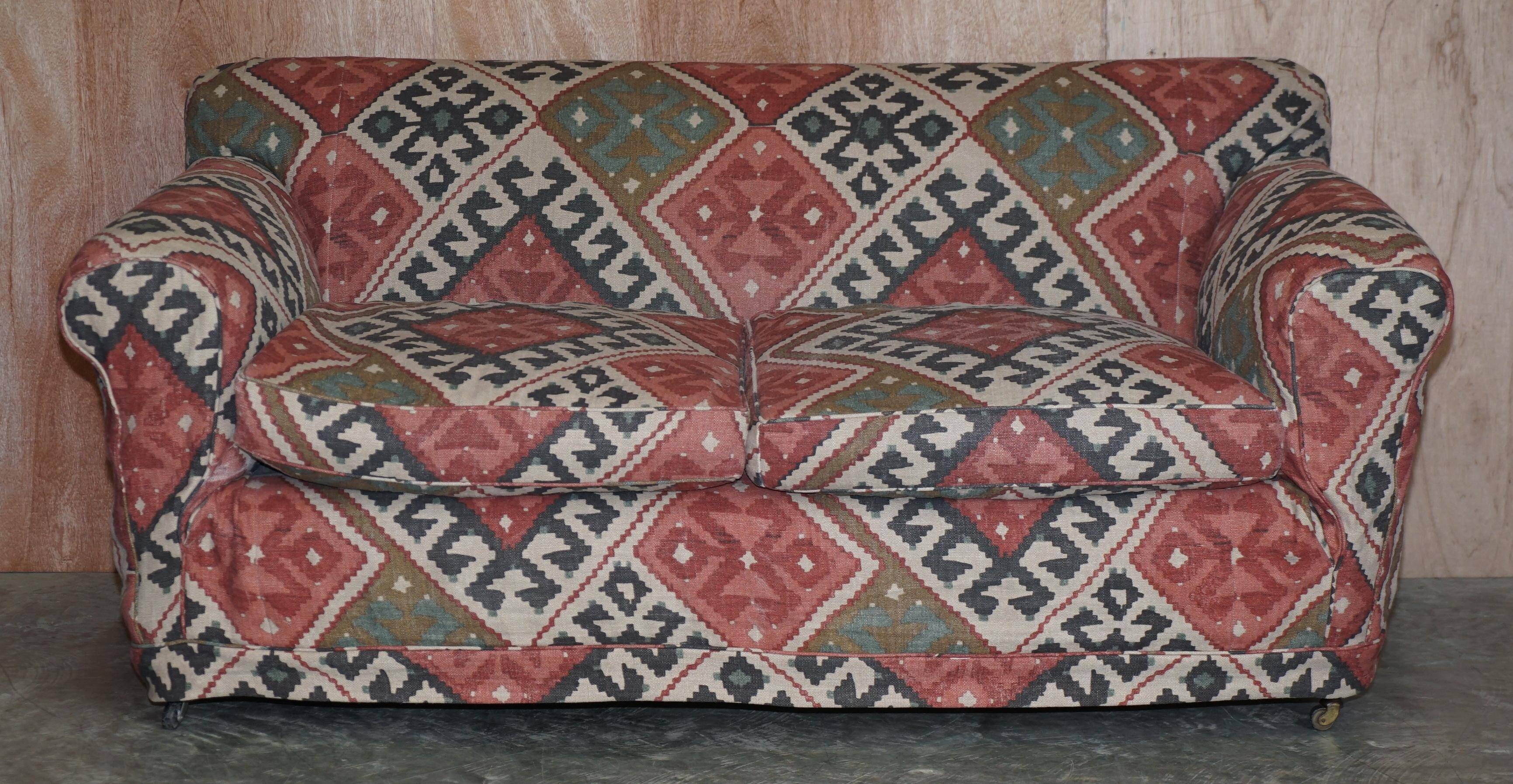 Victorian canapé upholstered in Kilim with turned mahogany legs.