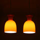 Pair of orange hanging lamps by Raak, the Netherlands, 1970