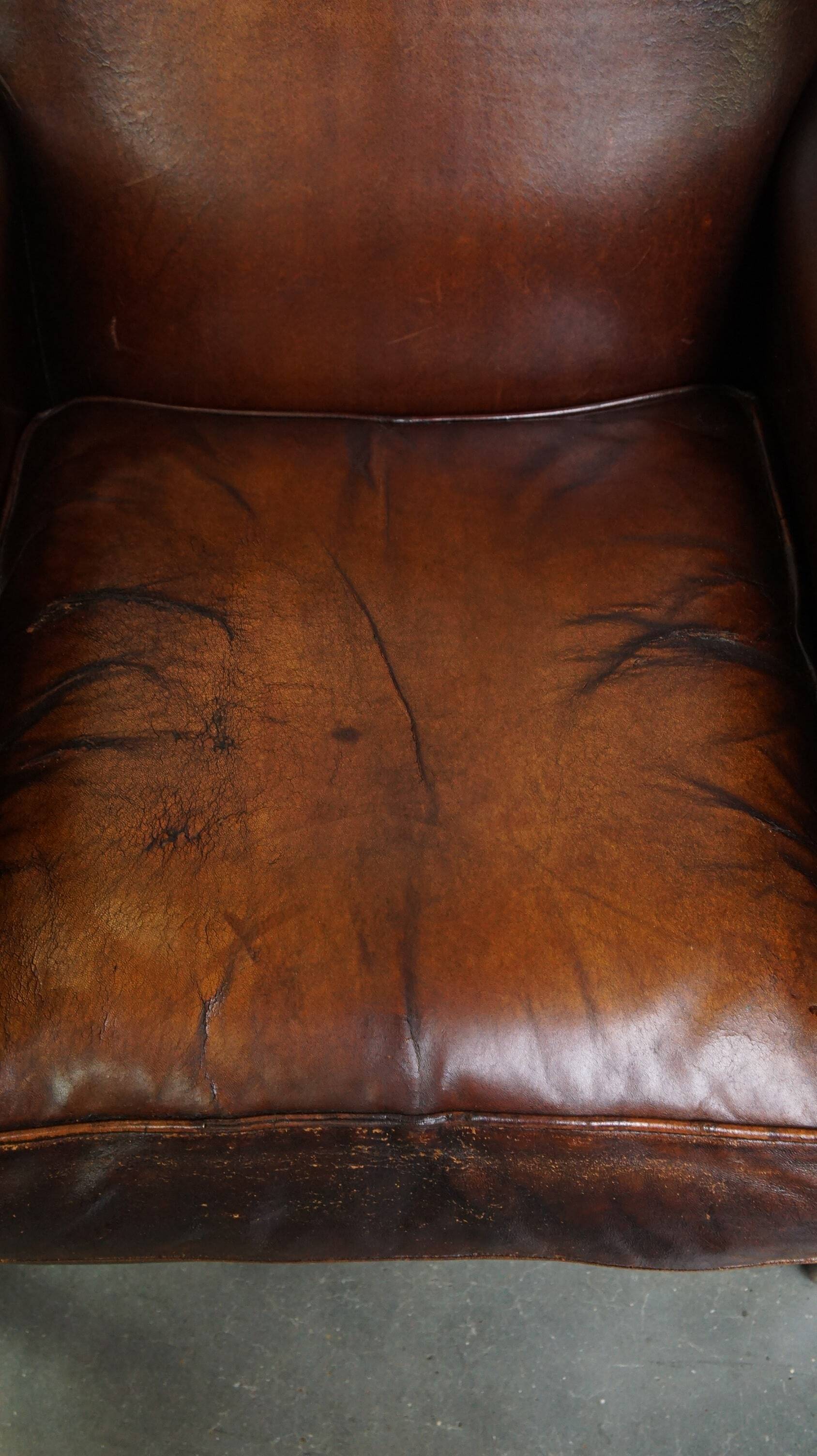 Vintage sheepskin armchair with beautiful warm colors and excellent seating comfort