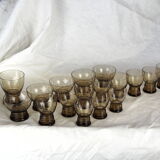Set of 17 black smoked glasses on geometric engraving stand - 70s