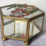 Glass box and hexagonal brass enamelled floral decoration