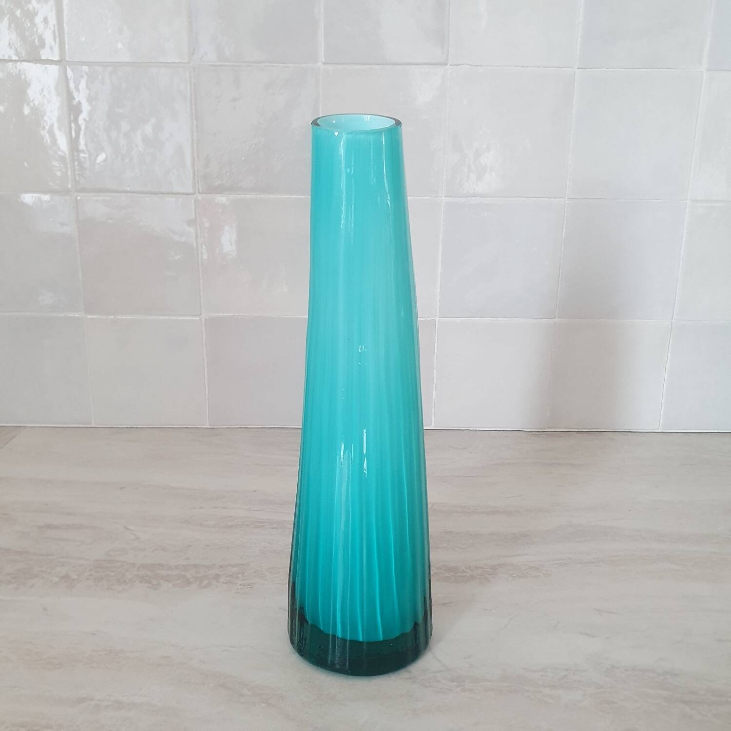 Curved turquoise blue blown glass soliflore vase