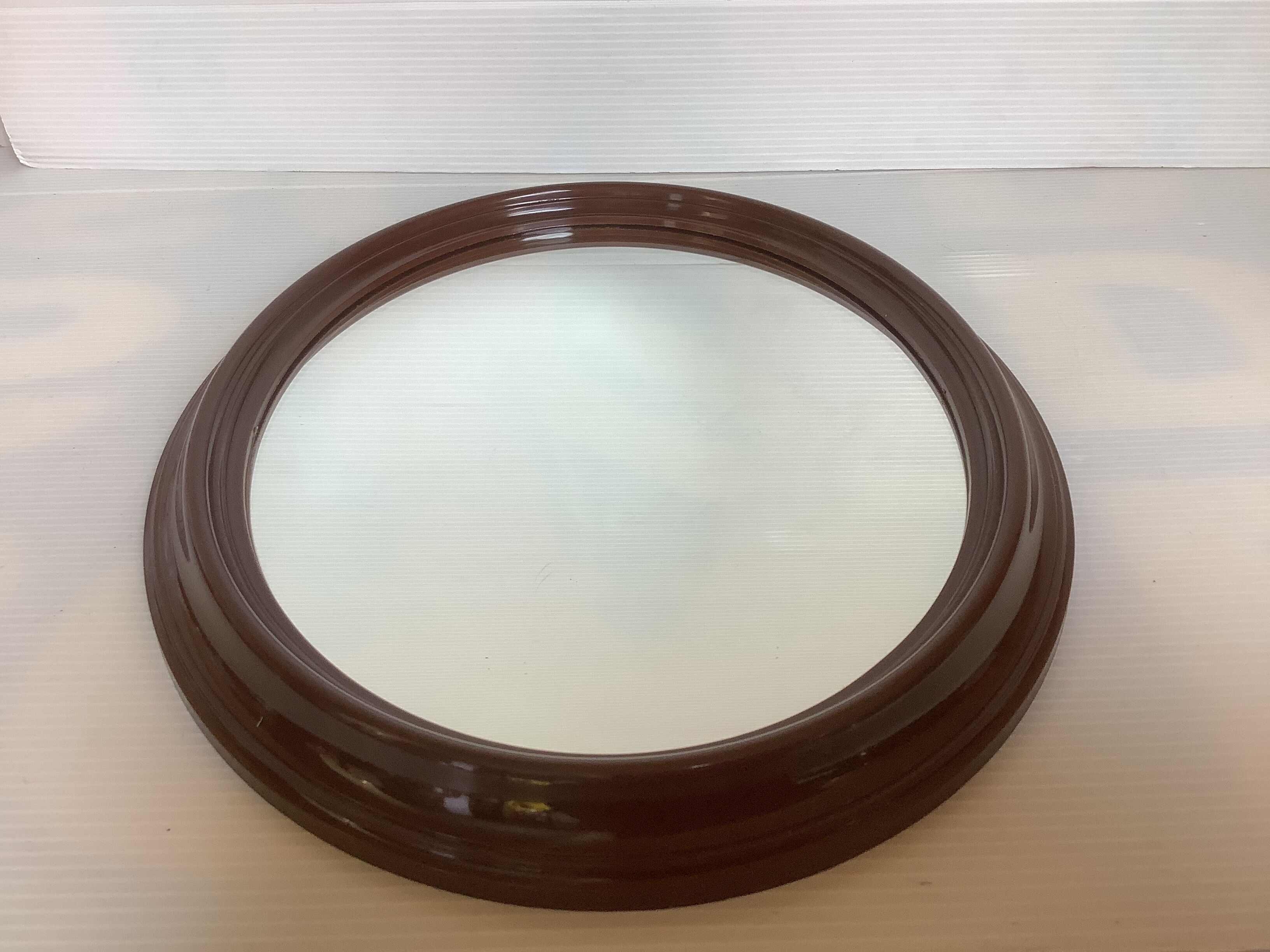 Brown plastic oval mirror made in belgium