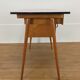 Bureau et chaise Baumann Pégase rouges, pieds compas