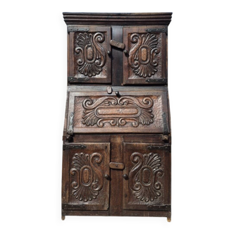 antique cabinet with carvings and wrought iron fittings rural