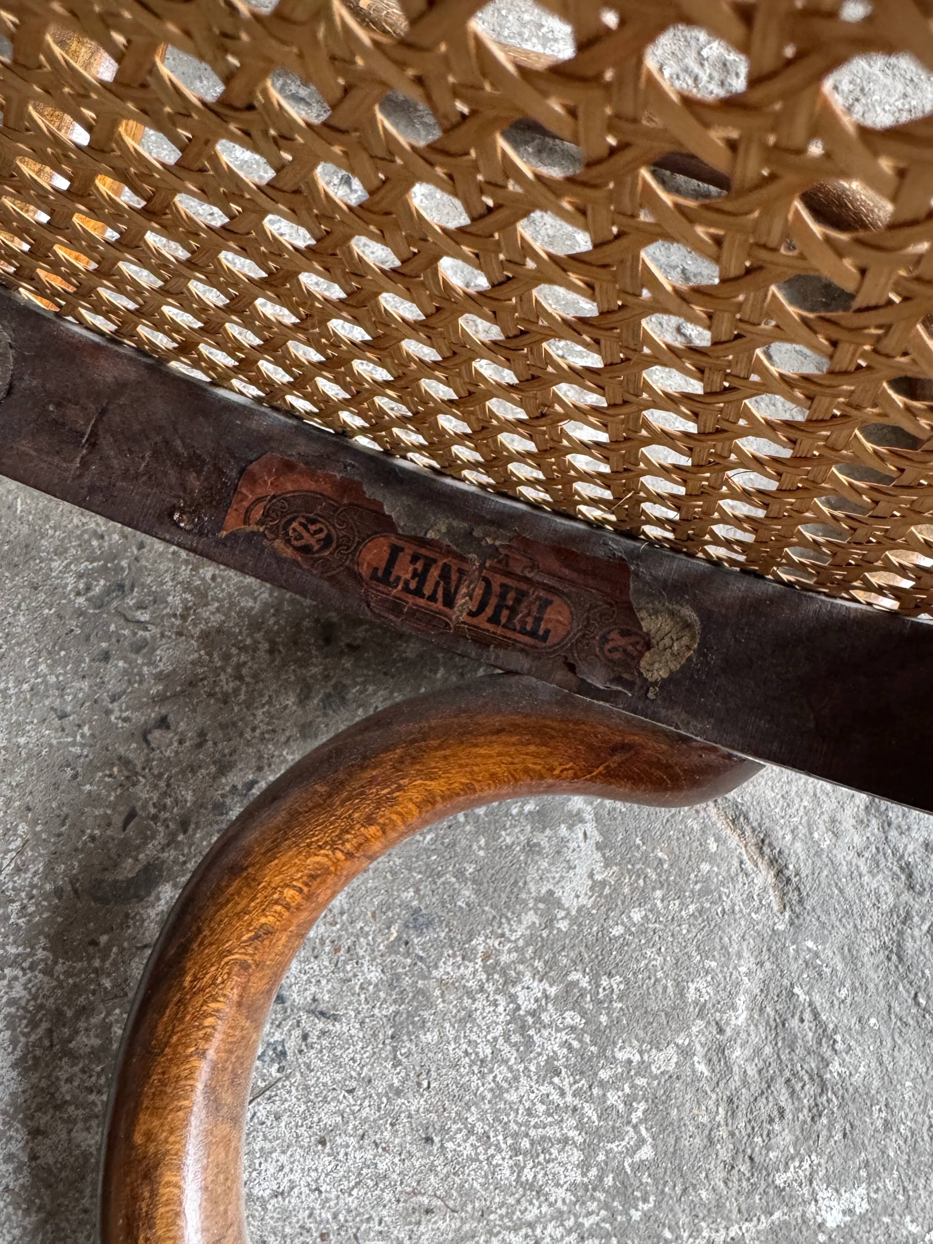 Warm walnut bentwood and cane child's rocking chair early 20th-century