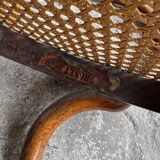 Warm walnut bentwood and cane child's rocking chair early 20th-century