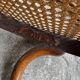Warm walnut bentwood and cane child's rocking chair early 20th-century