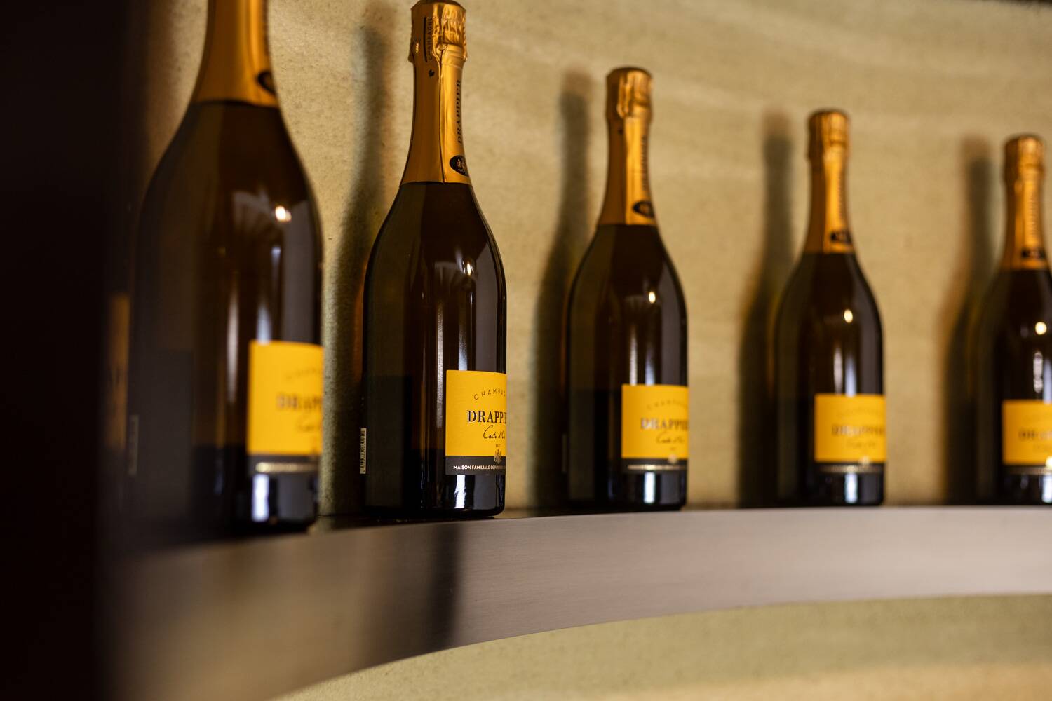 Circular bar in brushed metal, wood and carpet. 1970s.