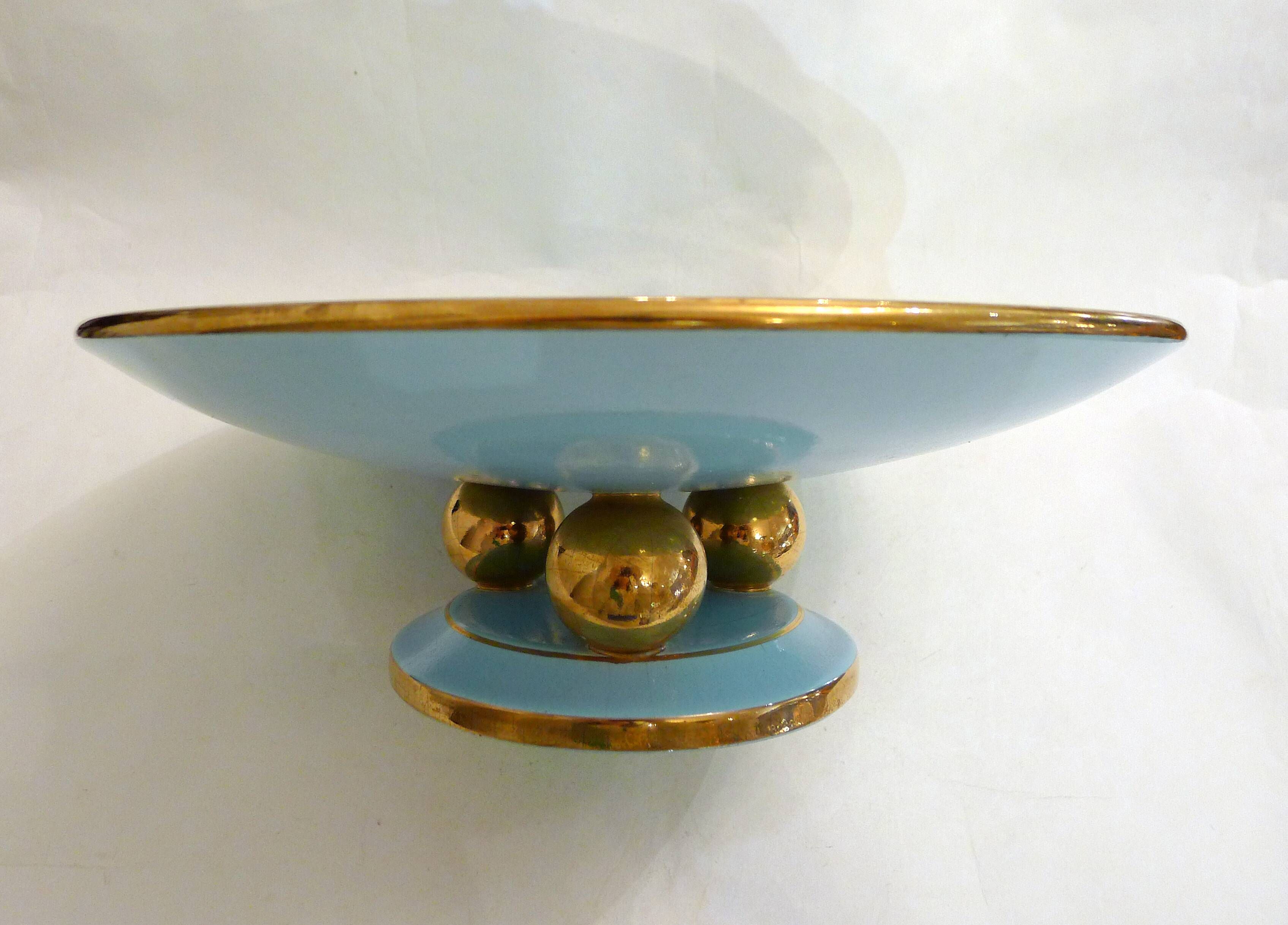 Art Deco modernist coupe, with a base of 3 spheres, in turquoise ceramic and gilding.