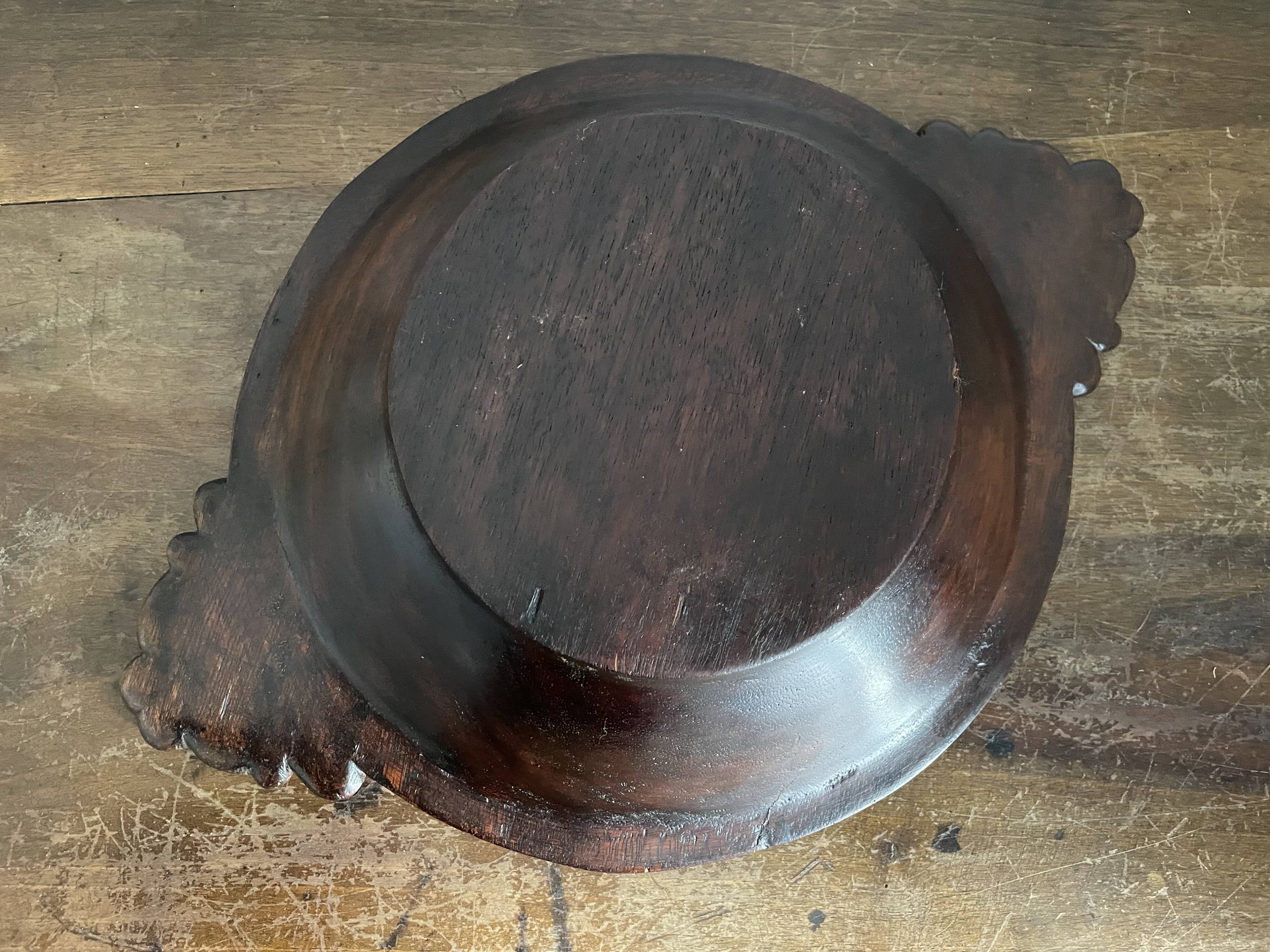 Hollow carved wooden dish