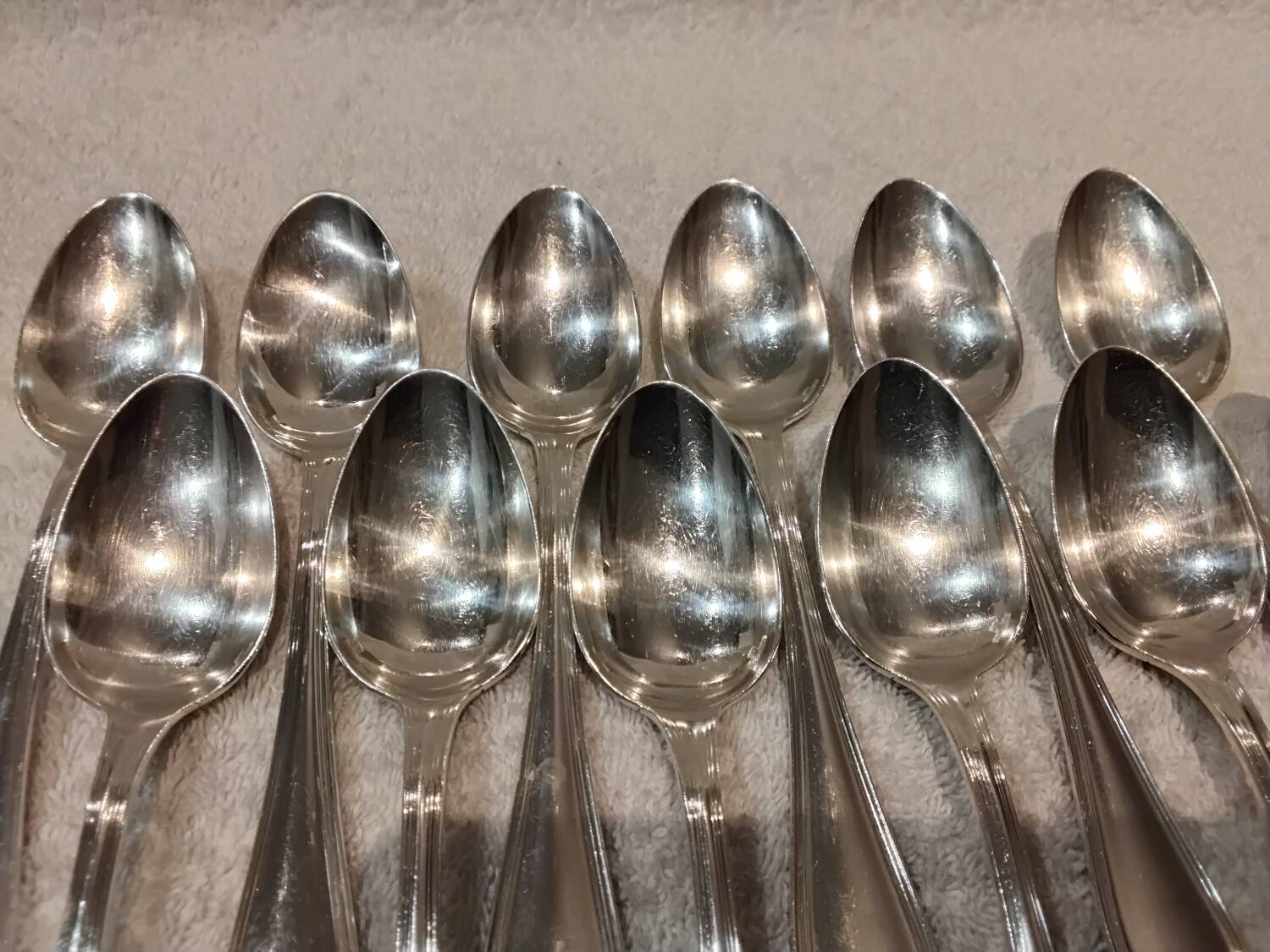 12 Christofle silver plated dessert spoons, 17cm