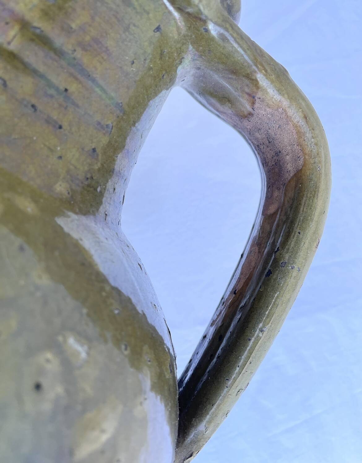 Ancient oil jar in glazed terracotta, khaki green — Auvergne, Lezou