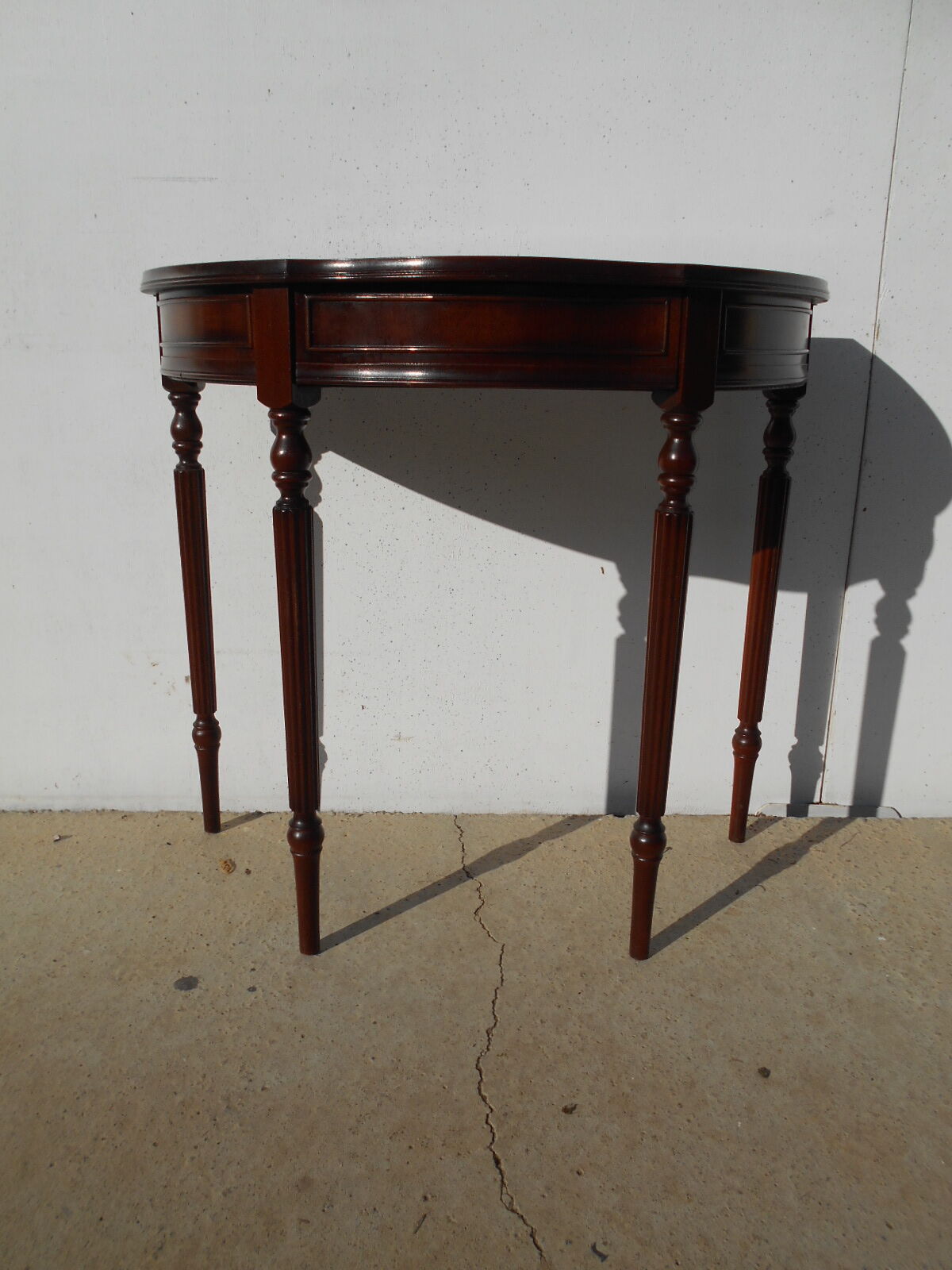 English-style half-moon console, mahogany and leather