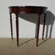 English-style half-moon console, mahogany and leather