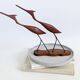 Scandinavian modernist sculpture cranes in teak.