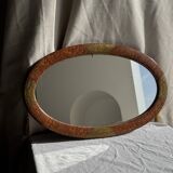 Small oval Art Deco mirror in brown and gold 33x54.