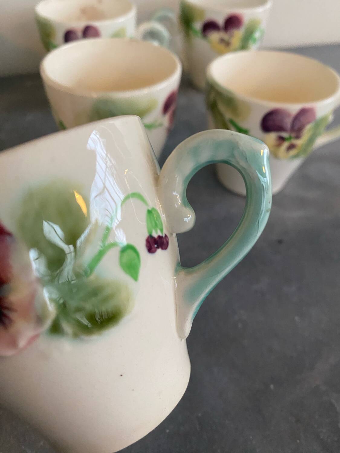 10 slipware cups, pansies
