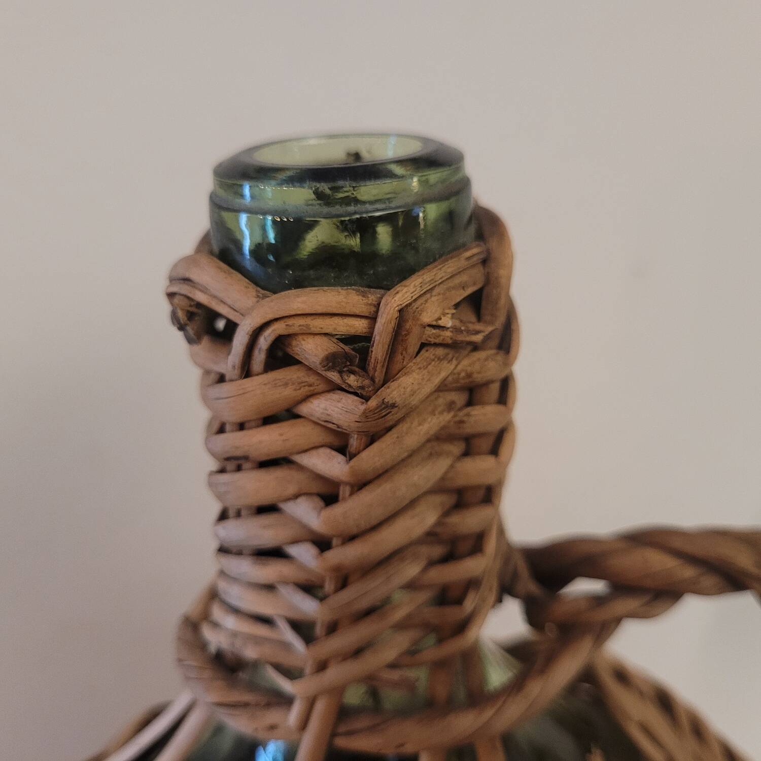Green glass carafe with wicker covering – 2 litres – 1960s–1970s