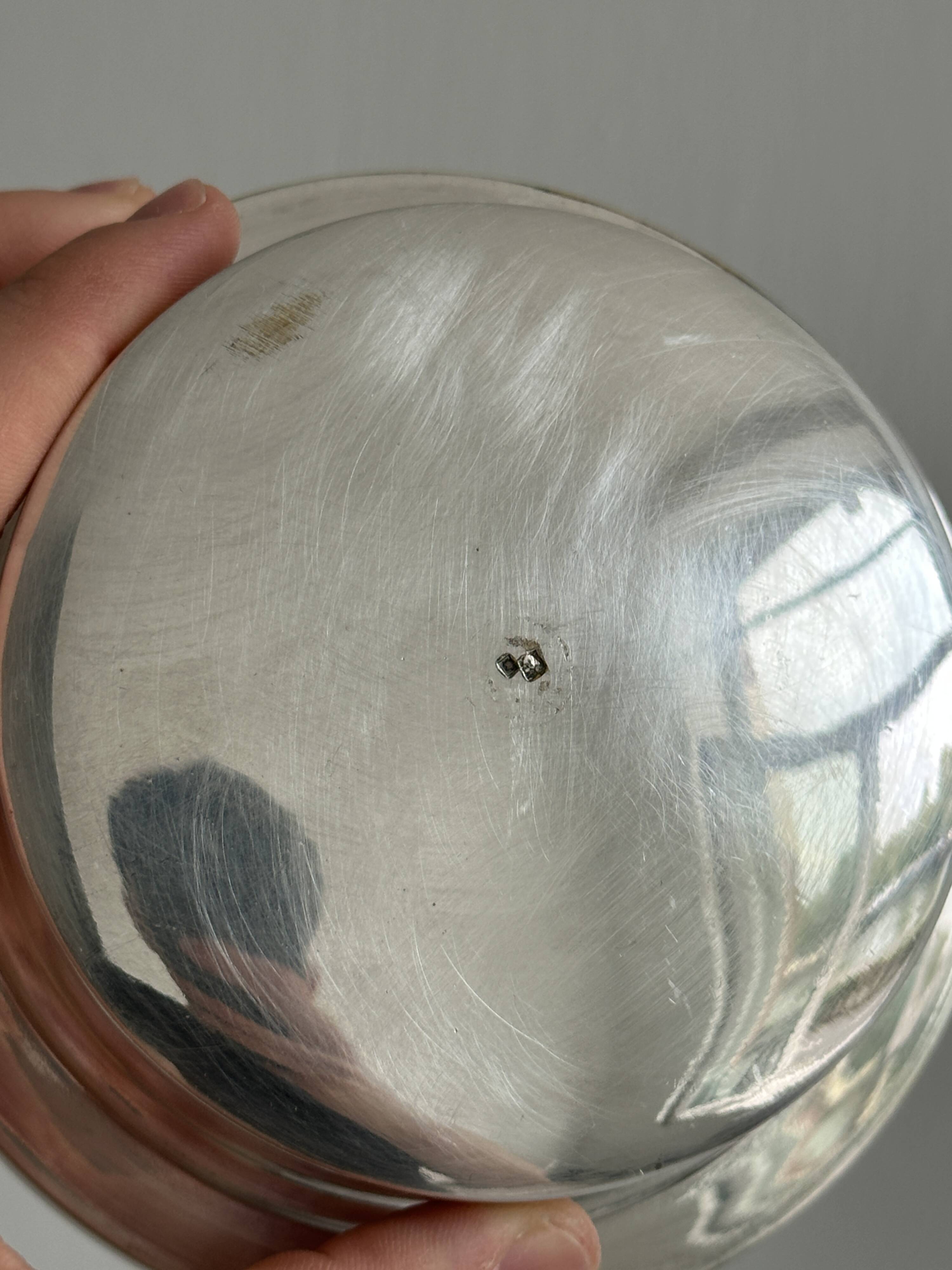 Antique butter dish in shiny metal