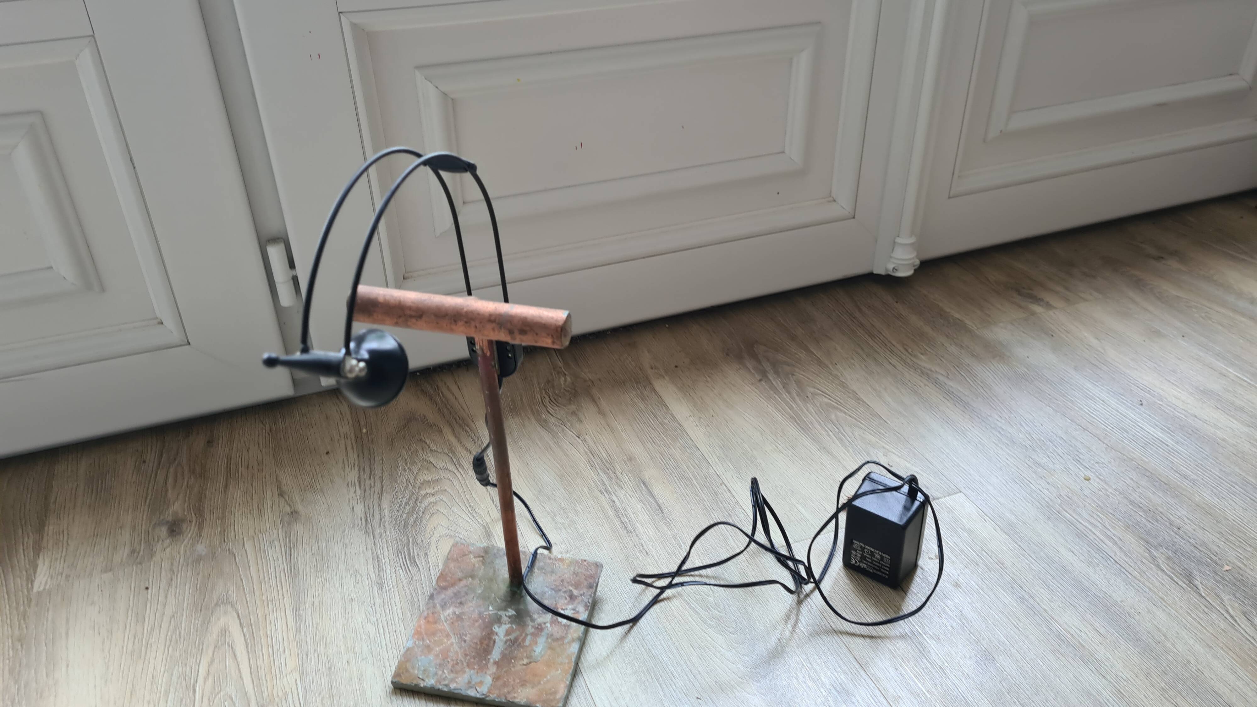 old lamp with stone base and copper arm