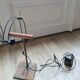 old lamp with stone base and copper arm