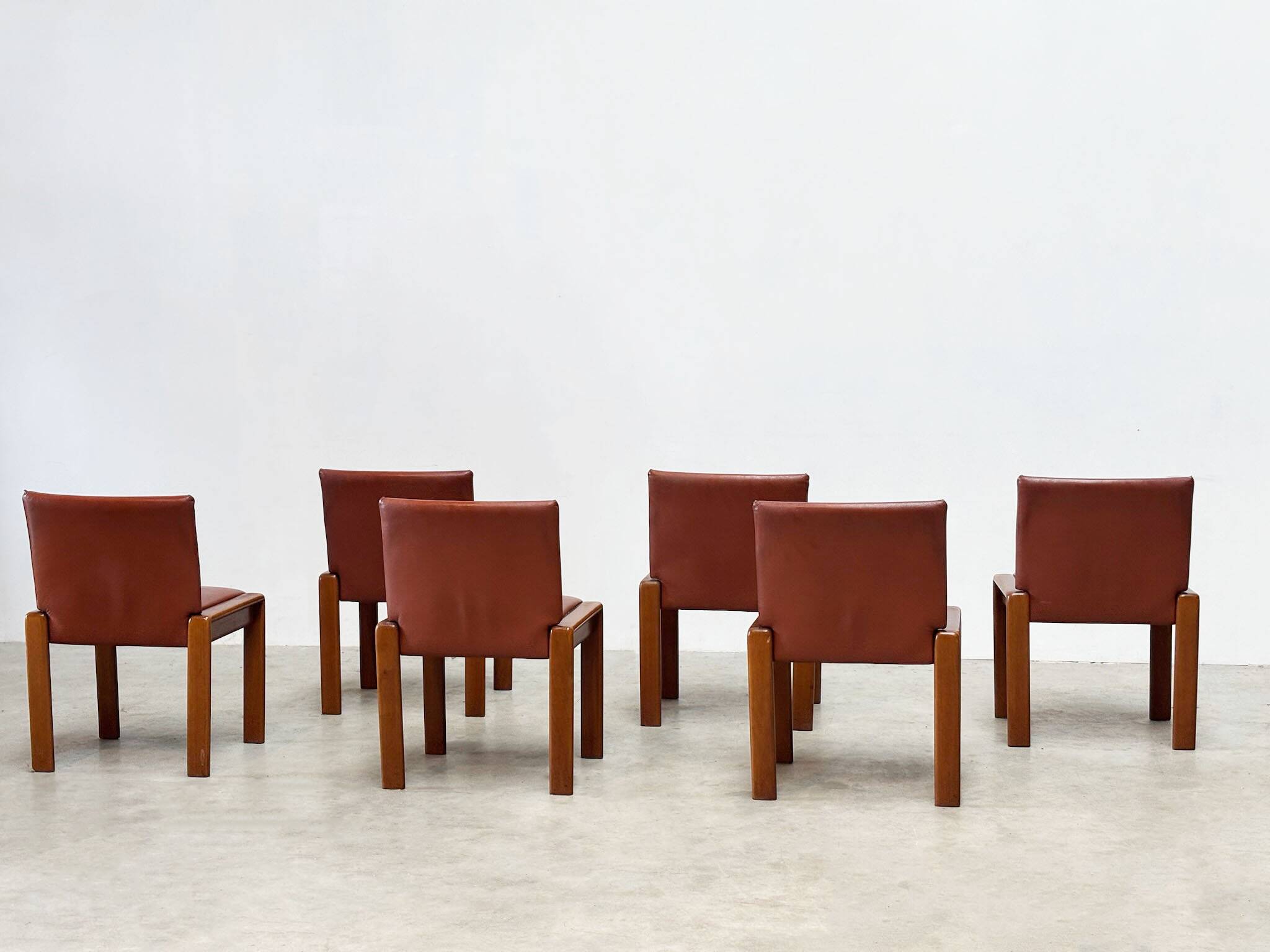 Set of six leather Italian dining chairs