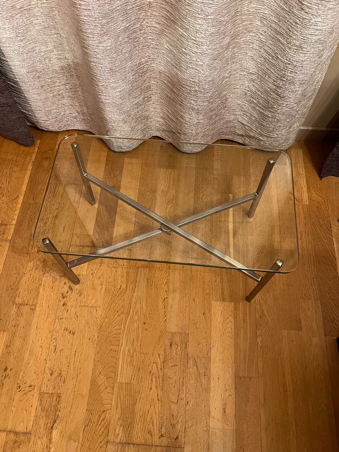 Small chrome and glass coffee table.