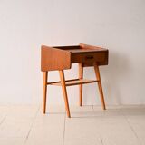 Bedside table with rattan magazine rack