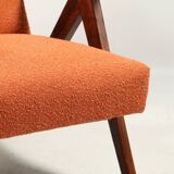 Vintage orange curly armchair Scandinavian design 1970