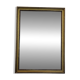 Vintage rectangular wall mirror with a golden wooden frame.