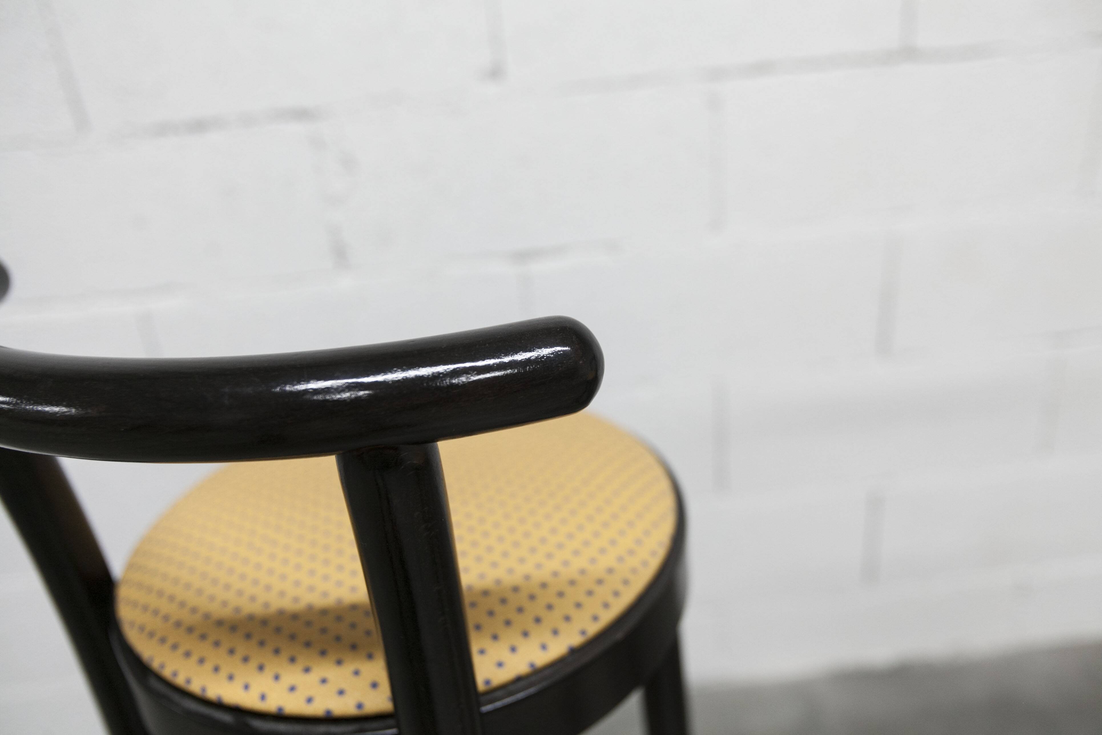 Pair of Baumann Dialog model stools in black and yellow and blue imitation leather, 1990