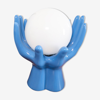 Ceramic lamp hands holding blue globe