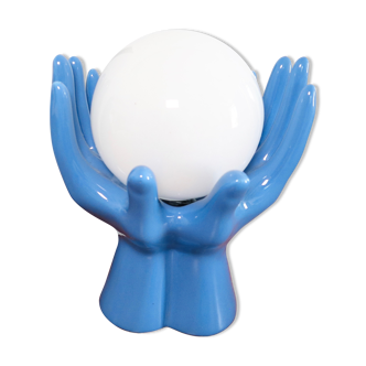 Ceramic lamp hands holding blue globe