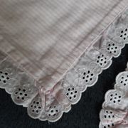 Old baby bed linen adornment