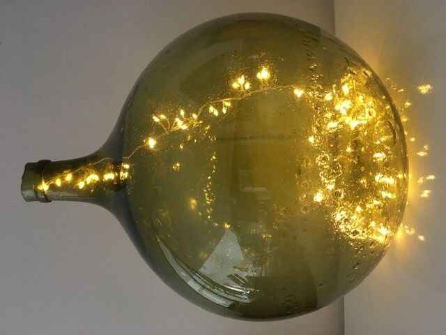 Old demijohn full of bubbles