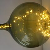 Old demijohn full of bubbles