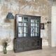 Display cabinet in patinated wood