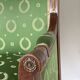 Fauteuil de style Empire en bois et tissu vert