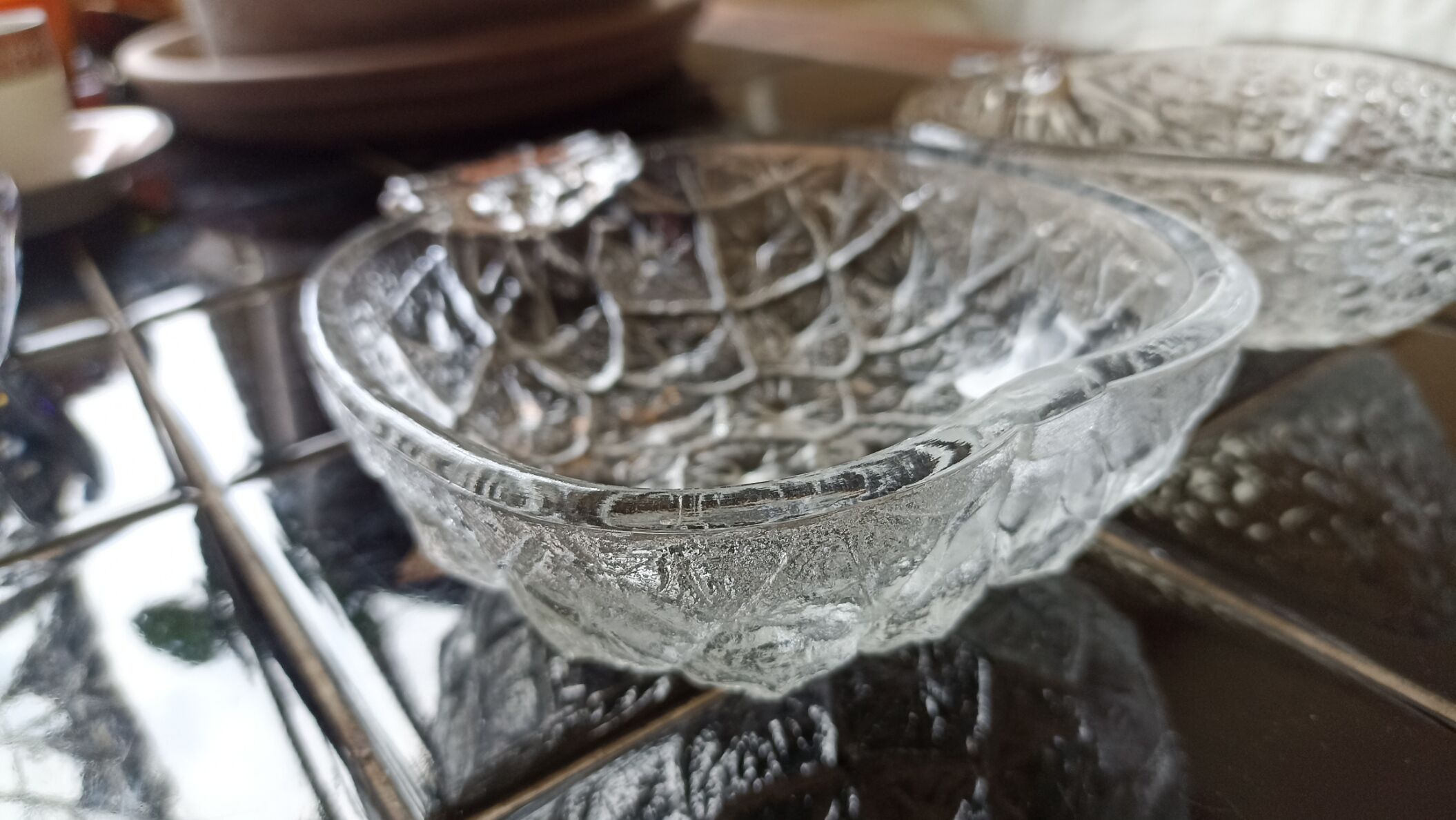 Two molded glass cups in the shape of strawberry and pineapple