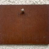 Small painting on wood.